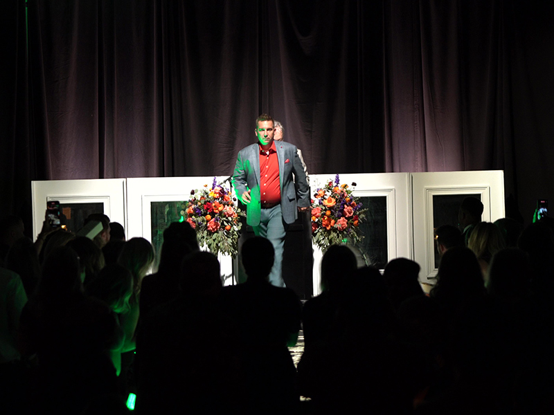 Mike Rains, Head of Operations at America’s Car-Mart, walks the runway at the Gentlemen of Distinction gala.