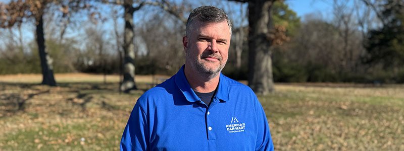 America’s Car-Mart associate and Head of Credit and Risk Management, Steve Kline poses outside at corporate headquarters in Rogers Arkansas.